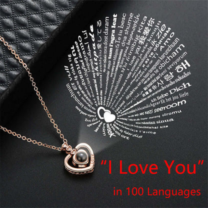A picture describing the I love you necklace. In this picture there is the necklace with a text over it saying I love you in 100 different languages.