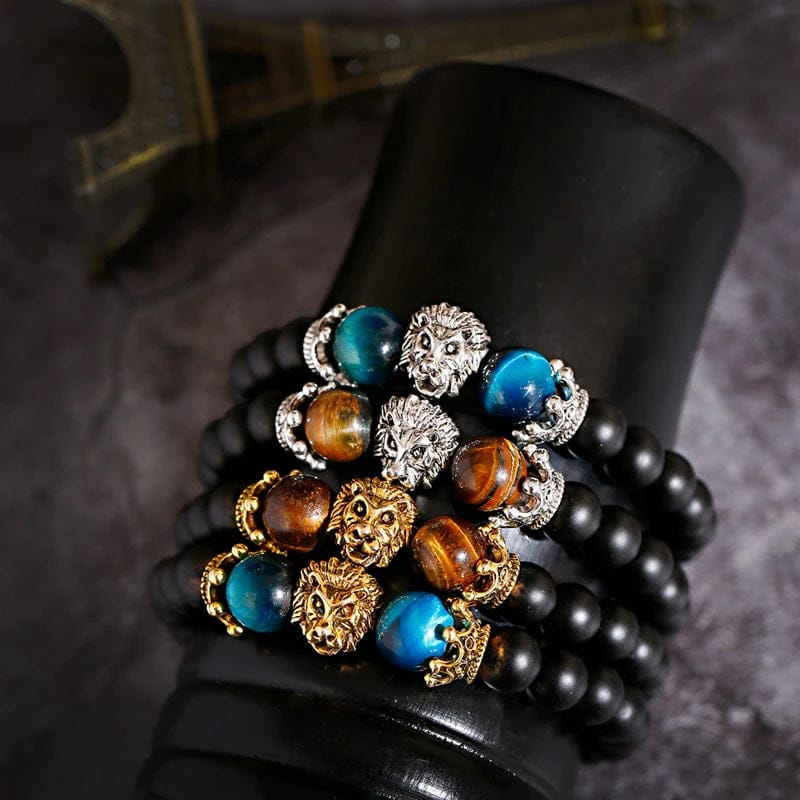 Showcasing five lion crown head black color beads bracelet on a stand.