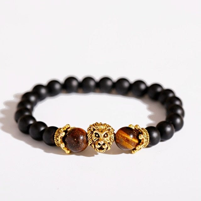 A gold lion crown bracelet with black beads